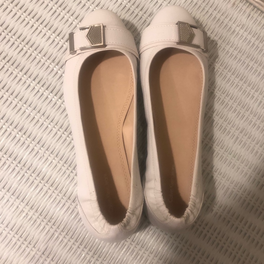 Women’s white Calvin Klein Jeans dress shoes